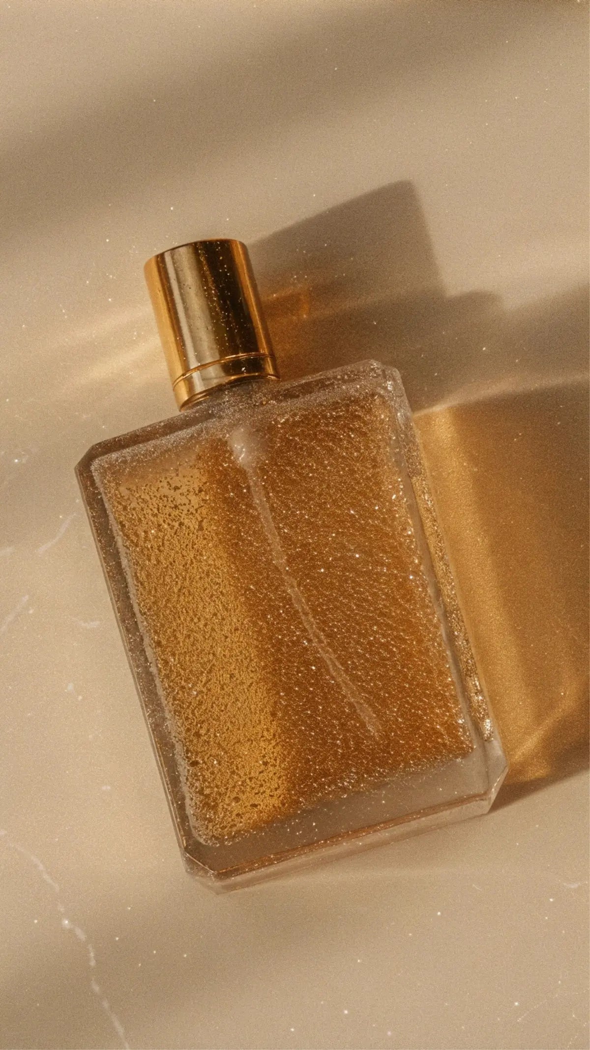 A bottle of perfume sitting on top of a counter